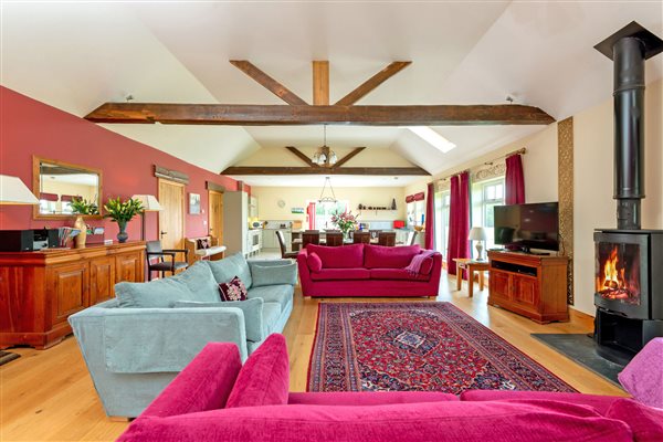 Spacious living room with beamed ceiling